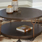 Brazburn - Dark Brown / Gold Finish - Round Cocktail Table