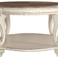 Realyn - White / Brown - Oval Cocktail Table