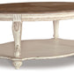 Realyn - Oval Cocktail Table - White / Brown