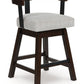 Haddigan - Upholstered Swivel Barstool (Set of 2) - Dark Brown