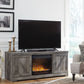 Wynnlow - Gray - 63" TV Stand With Glass/Stone Fireplace Insert