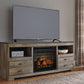 Trinell - Brown - 63" TV Stand With Glass/Stone Fireplace Insert