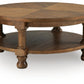 Chadworth - Round Cocktail Table - Medium Brown