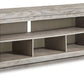 Naydell - XL TV Stand w/Fireplace Option - Gray