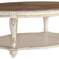 Realyn - White / Brown - Oval Cocktail Table